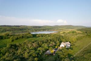 an aerial view of a house and a lake at Killoran House in Dervaig