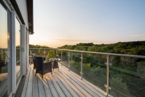 a balcony of a house with a view at Killoran House in Dervaig