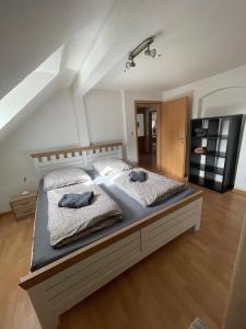 a bed with two pillows on it in a room at kuscheliges Marburg in Marburg an der Lahn