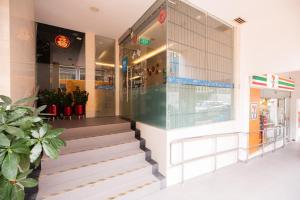 a store front with stairs in front of a building at ibis budget Singapore Clarke Quay in Singapore