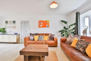 a living room with a couch and a coffee table at May Disc - Long Stay - Contractors in Bath