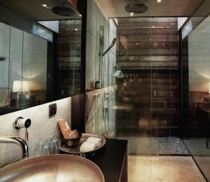a bathroom with a sink and a shower at Anyu Hotel Sanya in Sanya