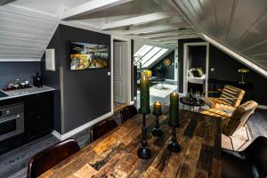 a kitchen and dining room with a wooden table at Vintage Apartment Hotel in Reykjavík