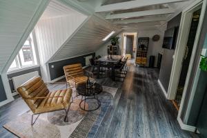 a living room with chairs and a table at Vintage Hotel in Reykjavík