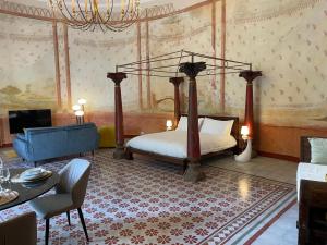 a bedroom with a bed and a tv in a room at Il Sogno di Elisa in Lucca