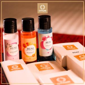 three bottles of beauty products sitting next to boxes at Otium Goa Resort by The Oterra in Porvorim