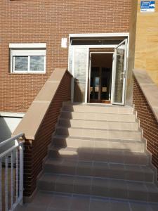a set of stairs leading up to a building at Chalet IFema 5 Habitaciones 4 baños, parking free in Madrid