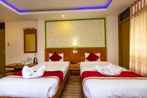 Un pat sau paturi într-o cameră la Hotel Sekai