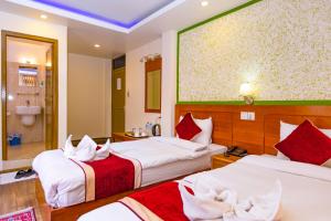 Un pat sau paturi într-o cameră la Hotel Sekai