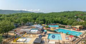 an aerial view of a pool at a resort at Mobile home 6 places camping 5 Vacances Gorges de lArdeche in Lagorce
