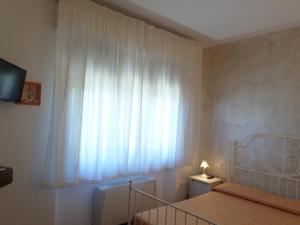 Posteľ alebo postele v izbe v ubytovaní Bed and Breakfast " Il Tesoro di Mario "