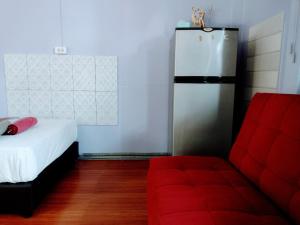 Postel nebo postele na pokoji v ubytování Mango Tree Guestroom