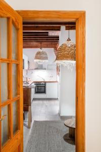 Kuchyňa alebo kuchynka v ubytovaní Touch My Heart Malaga City center apartment BY NAMASTE ELITE