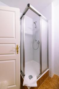 a shower stall in a bathroom with a door at Burg Satzvey in Mechernich