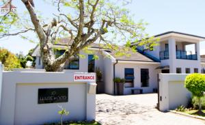 a house with a no mortgage sign in front of it at JFT Jewels Guest House in East London