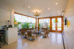 a dining room with a table and chairs at The Mohua - A Boutique Hotel in Rānchī