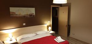 Postel nebo postele na pokoji v ubytování B&B Al Centro