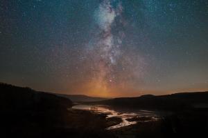a night view of the milky way over a river at Ardtornish House Victorian Apartments in Strontian