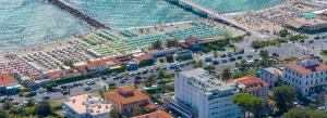 an aerial view of a city with a beach at Hotel Excelsior in Marina di Massa