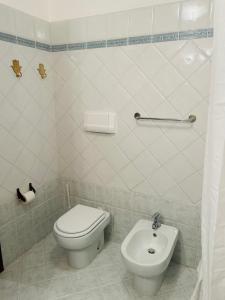 a bathroom with a toilet and a bidet at Civico 7 in Clusane sul Lago +7 photos