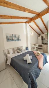 a bedroom with a large bed in a room at Poolside Studio in Fažana