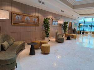 a lobby with couches and chairs and tables at Hotel Torremar - Mares in Torre del Mar