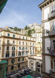 a large building with cars parked in front of it at Luxury apartment in Naples in Naples