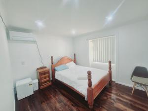 a small bedroom with a bed and a window at Kaban Power 39 in Bidwill