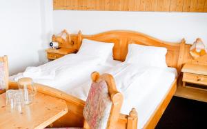 Letto o letti in una camera di Workation Apartments - 24-7 Self-Checkin - Hotel Postigliun Sedrun