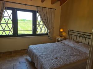Ein Bett oder Betten in einem Zimmer der Unterkunft Appartamentino in az agricola Le vigne del Moretto