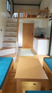 a small room with a bunk bed and a table at ROTA OLYMPOS TİNY HOUSE in Kumluca