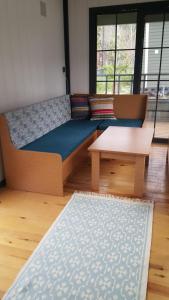 a room with a couch and a table in a room at ROTA OLYMPOS TİNY HOUSE in Kumluca