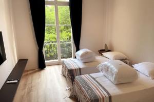 Postel nebo postele na pokoji v ubytování Augusta Palace - T3 **** 74m² - 150m Croisette