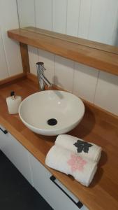 a bathroom with a sink and a towel on a counter at ROTA OLYMPOS TİNY HOUSE in Kumluca