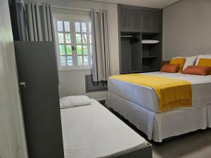 Ένα ή περισσότερα κρεβάτια σε δωμάτιο στο Flat na Riviera de São Lourenço com serviço de hotelaria +23 φωτογραφίες