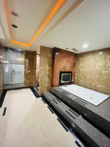 a large room with a bath tub in a building at Walker Hotel - Chengde in Taipei