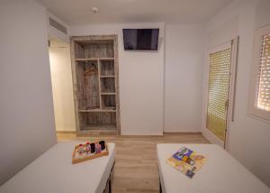 TV a/nebo společenská místnost v ubytování Agi Gloria Rooms