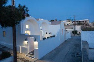a view of a white house at night at Casa Evgenia in Pyrgos
