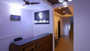 a room with a counter and a ceiling fan at Blossom Bed Resort Vagamon by Lexstays in Vagamon