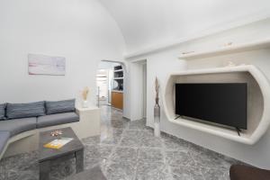 a living room with a large flat screen tv at Casa Evgenia in Pyrgos
