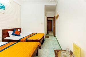 Giường trong phòng chung tại SPOT ON 1227 Binh Minh Hotel