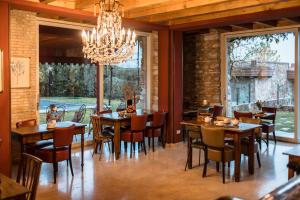 Reštaurácia alebo iné gastronomické zariadenie v ubytovaní Le Greghe Suites