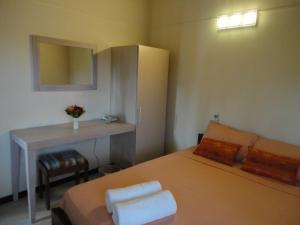 Voodi või voodid majutusasutuse Ocean Villas Hotel toas