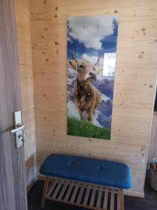 a wall with a picture of a deer on it at Ferienwohnung Am Roten Berg in Peiting