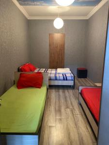 a room with two beds in a room at ARTISHA TRAVEL TBILISI in Tbilisi City
