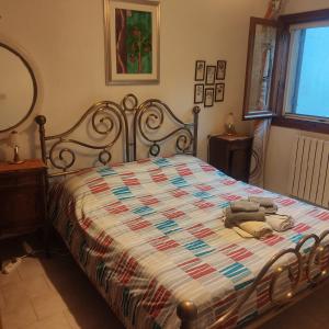 a bedroom with a bed with a quilt on it at Villa roverella in Cassano delle Murge