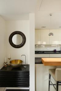 a kitchen with a bowl sink on a counter at Jerusalem Holiday Luxury Home by FeelHome in Jerusalem