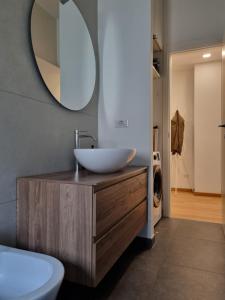 a bathroom with a sink and a mirror at Massi’s House in Milan