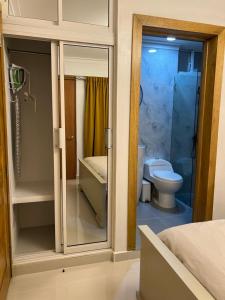 a bathroom with a shower and a toilet in it at Apartamento centro de la ciudad in San Pedro de Macorís