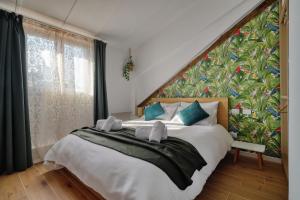 A bed or beds in a room at AMI’s Terrace - new gem in CityLife district